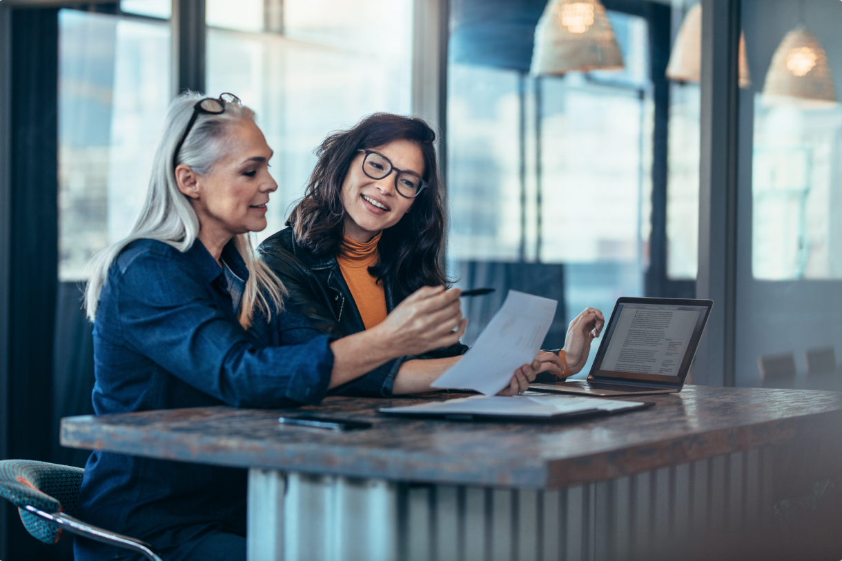 Image of Two People Working Together