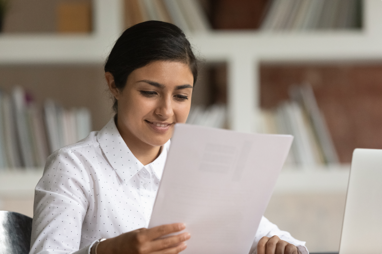 Person Reading Paperwork Image