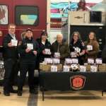 Officials from Enbridge Gas Ontario, Fire Marshal's Public Safety Council and Southwest Middlesex Council and Fire Department receive donated CO alarms.